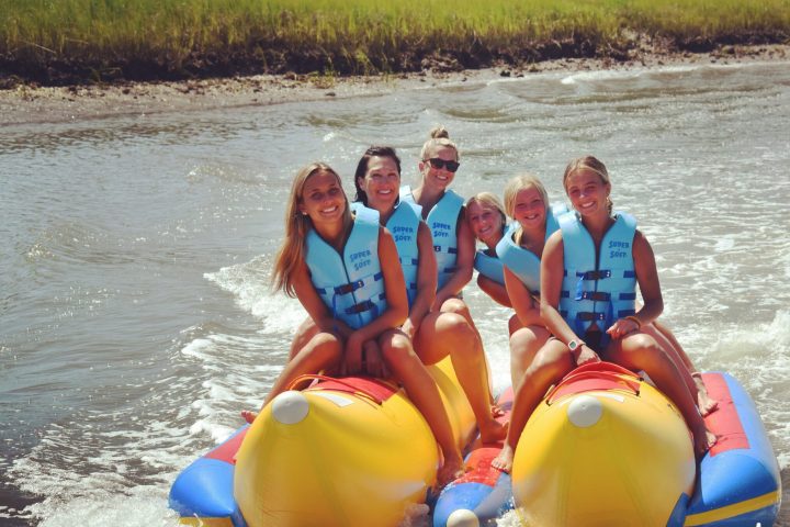 a group of people on a raft in the water